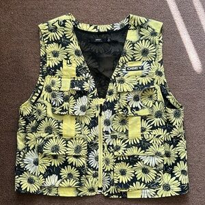Obey brand vest in size small. yellow daisies, front pockets, zip up